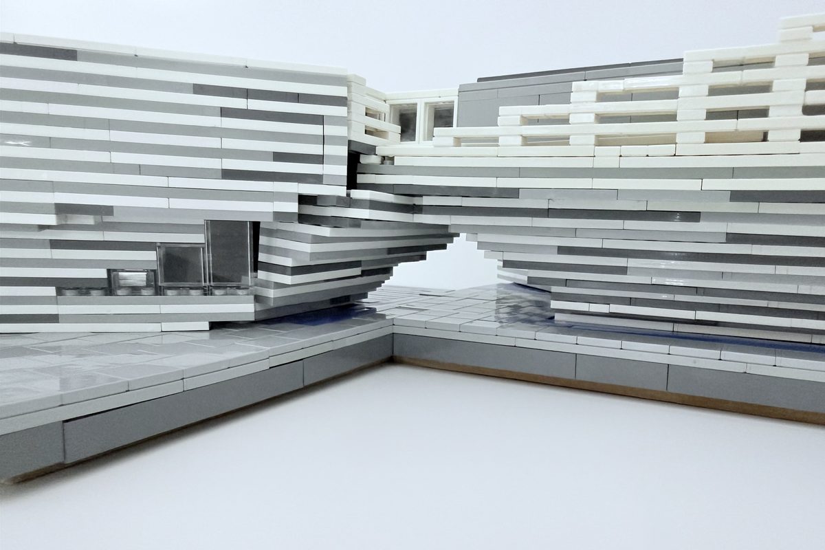 The gap between the museum's two halves, seen through the LEGO model at eye level