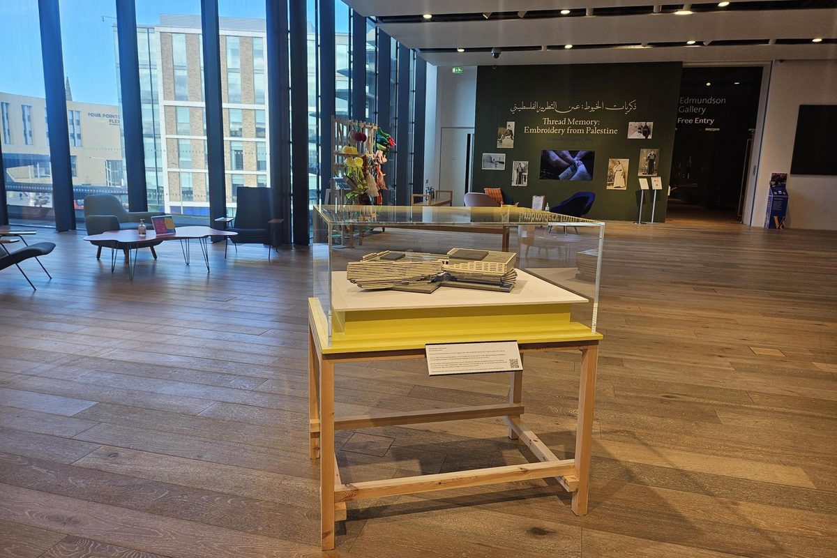 The LEGO model on display in a case inside V&A Dundee