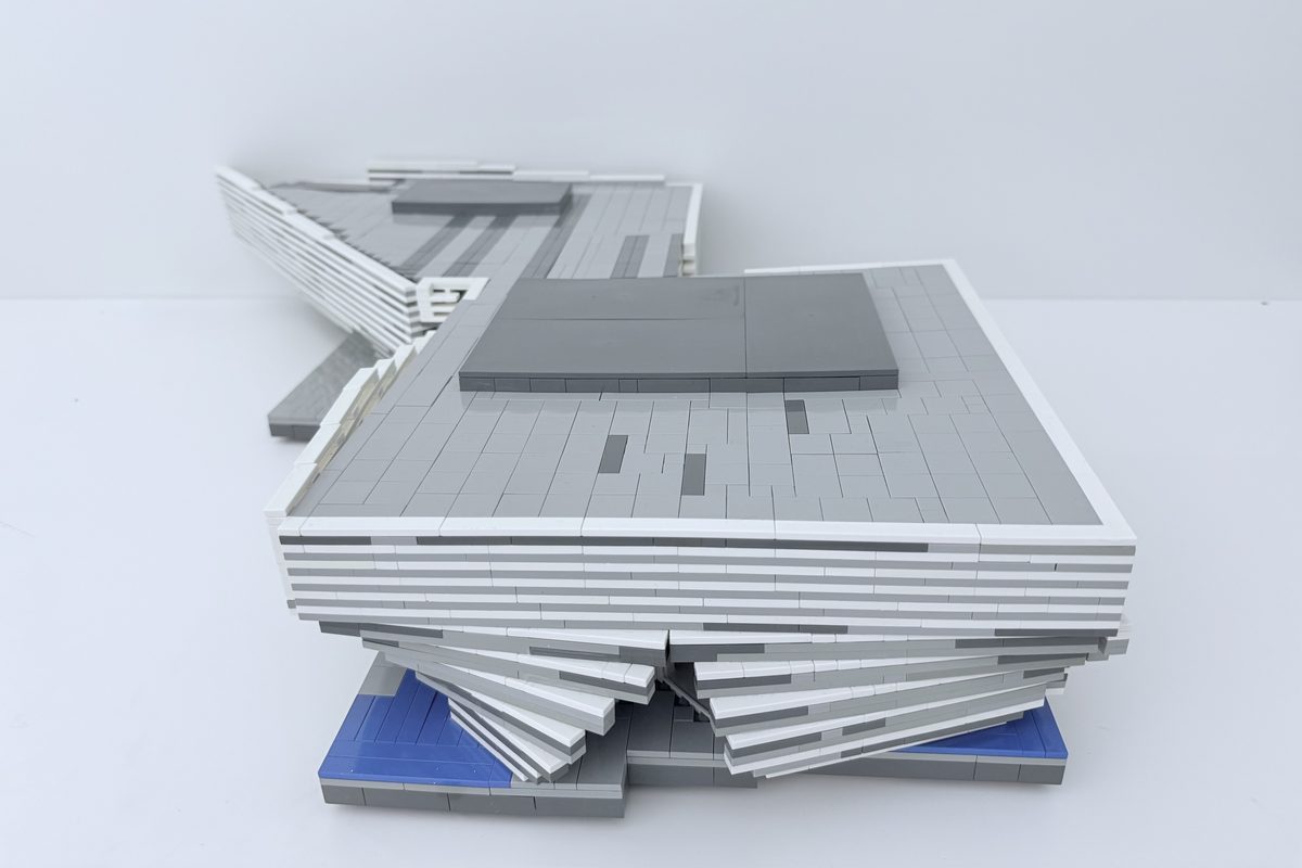 The banded roofline of the LEGO model, with the prow of the second wing behind